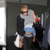 Charlize Theron et son fils de retour à Los Angeles, le 20 mars 2014.