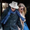 Johnny Depp et sa fiancée Amber Heard quittent leur hôtel main dans la main, à New York, le 22 mars 2014