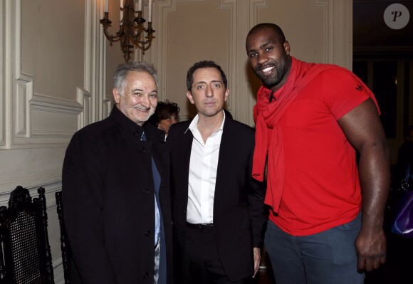 Exclusif - Jacques Attali, Gad Elmaleh et le judoka Teddy Riner après le spectacle de l'humoriste "Sans Tambour" à l'Opéra Garnier à Paris le 16 mars 2014.