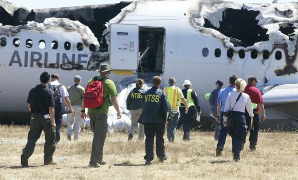 National Transportation Safety Board investigators work Sunday, July 7, 2013, on their investigation into the cause of Saturday's crash of Asiana Flight 214, a Boeing 777 aircraft, at San Francisco International Airport. Two people were killed and close to 200 injured in the crash. Photo by NTSB/MCT/ABACAPRESS.COM08/07/2013 - San Francisco