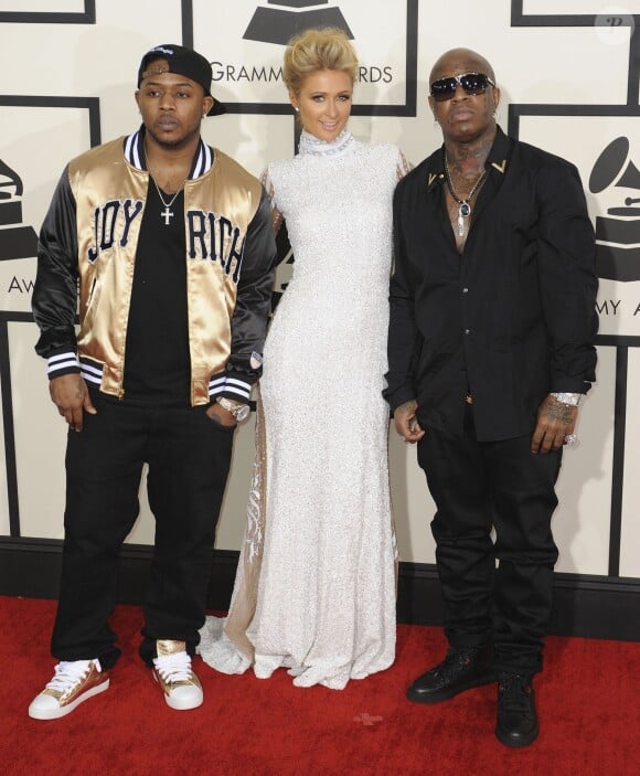 Birdman (ici à droite, avec Paris Hilton et Mack Maine) lors des - 56e Grammy Awards à Los Angeles, le 26 janvier 2014.