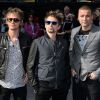 Le groupe Muse avec Dominic Howard, Matt Bellamy et Christopher Wolstenholme à Londres le 2 juin 2013.
