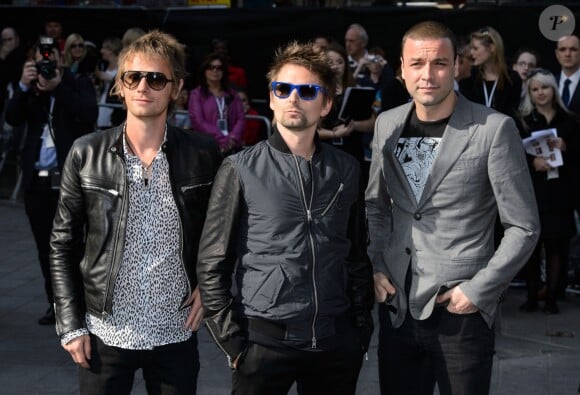 Le groupe Muse avec Dominic Howard, Matt Bellamy et Christopher Wolstenholme à Londres le 2 juin 2013.