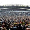 Les supporters de Manchester City fêtent le titre de champion d'Angleterre dans leur Etihad Stadium le 11 mai 2014. 