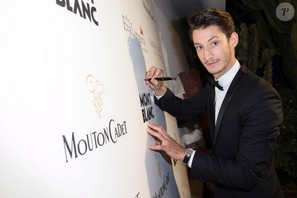 Pierre Niney lors de la soirée "Global Gift Gala" lors du 67ème festival international du film de Cannes, le 16 mai 2014.