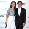 Carole Bouquet et Philippe Sereys de Rothschild lors de la soirée "Global Gift Gala" lors du 67ème festival international du film de Cannes, le 16 mai 2014.