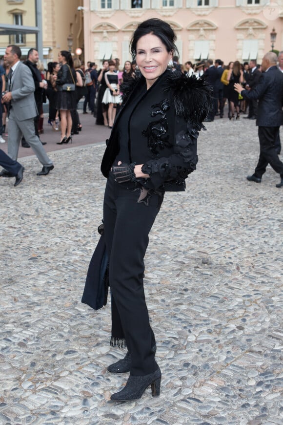 Mouna Ayoub lors du défilé Croisière Louis Vuitton organisé sur le parvis du palais princier de Monaco, le 17 mai 2014, et placé sous le haut patronage de la princesse Charlene.