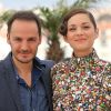 Fabrizio Rongione et Marion Cotillard - Photocall du film "Deux jours, une nuit" lors du 67e Festival international du film de Cannes, le 20 mai 2014.