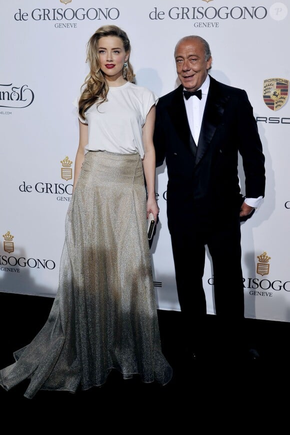 Amber Heard et Fawaz Gruosi - Photocall de la soirée de Grisogono à l'hôtel Eden Roc au Cap d'Antibes lors du 67e Festival du film de Cannes, le 20 mai 2014.