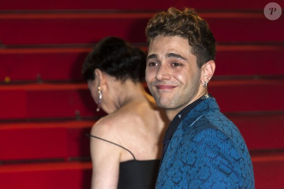 Xavier Dolan à la montée des marches pour le film "Mommy" lors du 67e Festival de Cannes, le 22 mai 2014.
