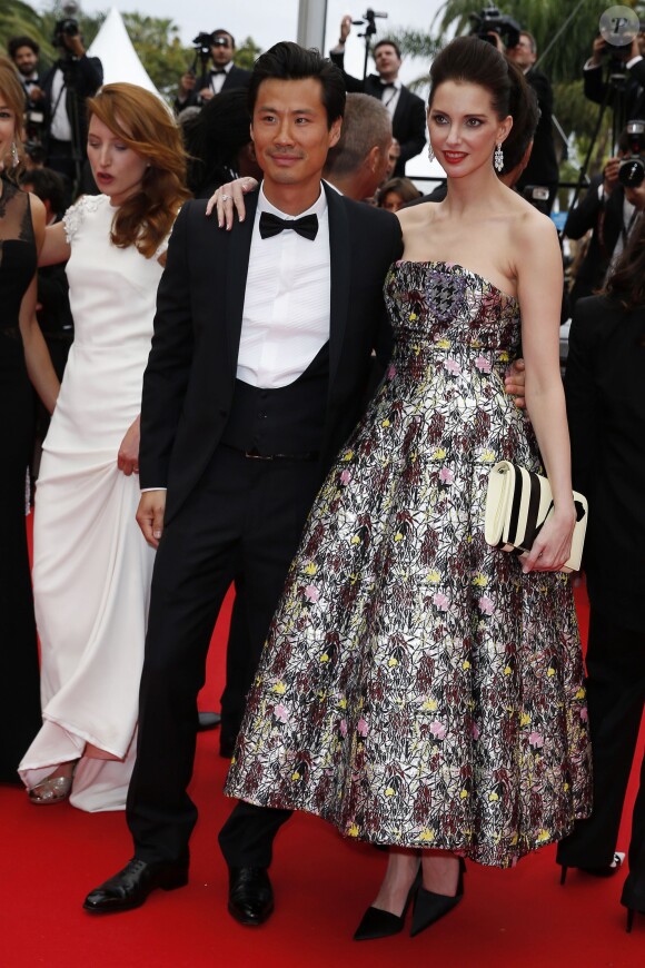 Frédéric Chau et Frédérique Bel - Montée des marches du film "Jimmy's Hall" lors du 67e Festival du film de Cannes le 22 mai 2014