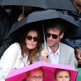  Zoé Félix et son compagnon Benjamin Rolland, derrière Karin Viard et sa maman, lors du match entre Jo-Wilfried Tsonga et Jürgen Melzer à Roland-Garros à Paris, le 28 mai 2014.  