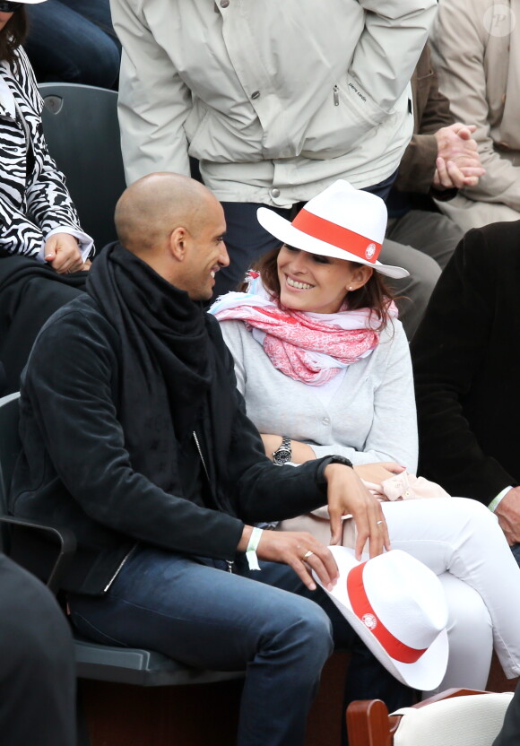 Le footballeur Aurélien Capoue et sa femme Rachel Legrain-Trapani lors du match entre Jo-Wilfried Tsonga et Jürgen Melzer à Roland-Garros à Paris, le 28 mai 2014. 