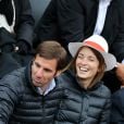  Gonzalo Quesada et sa femme Isabelle Ithurburu lors du match entre Jo-Wilfried Tsonga et Jürgen Melzer à Roland-Garros à Paris, le 28 mai 2014.  