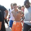 Justin Bieber, torse nu, se promène sur la Croisette lors du 67ème festival international du film de Cannes. Le 20 mai 2014.