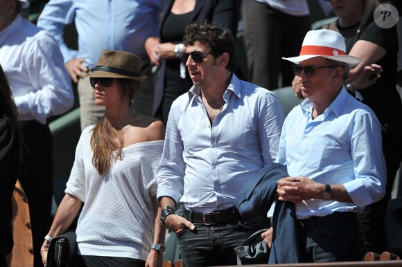 Patrick Bruel et sa compagne Caroline, Michel Drucker aux Internationaux de France de tennis de Roland Garros à Paris, le 6 juin 2014
