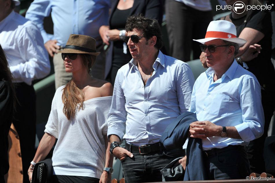 Patrick Bruel et sa compagne Caroline, Michel Drucker aux Internationaux de France de tennis de Roland Garros à Paris, le 6 juin 2014