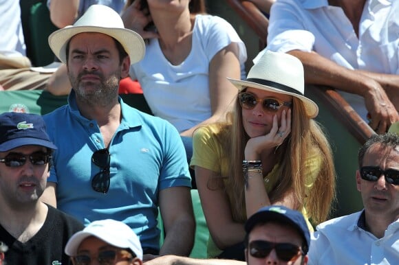 Clovis Cornillac et sa femme Lilou Fogli aux Internationaux de France de tennis de Roland Garros à Paris, le 6 juin 2014
