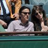 Charlotte Gainsbourg et Yvan Attal aux Internationaux de France de tennis de Roland Garros à Paris, le 6 juin 2014