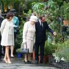 Le prince Philip, duc d'Edimbourg, Anne Hidalgo, la reine Elisabeth II d'Angleterre, François Hollande à l'occasion d'une visite du marché aux fleurs - qui porte le nom Elizabeth II - à Paris le 7 juin 2014.