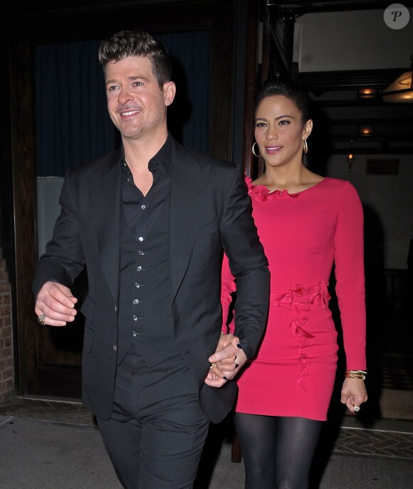 Robin Thicke et sa femme Paula Patton sortent de leur hôtel à New York, le 23 octobre 2013. 