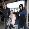 Courteney Cox, son petit ami Johnny McDaid et sa fille Coco arrivent à l'aéroport de LAX à Los Angeles pour prendre l'avion pour l'Europe, le 14 février 2014