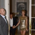 Charlize Theron et son compagnon Sean Penn se sont rendus chez Dior, avenue Montaigne, avant d'aller assister au défilé de la maison le 7 juillet 2014
