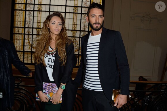 Nabilla Benattia et son amoureux Thomas Vergara assistent au défilé Jean-Paul Gaultier à Paris le 9 juillet 2014