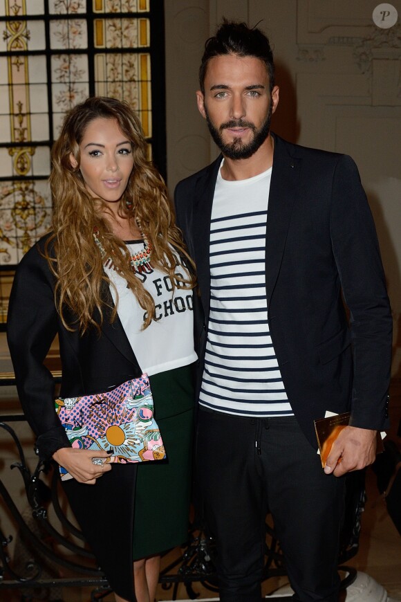 Nabilla Benattia et son amoureux Thomas Vergara assistent au défilé Jean-Paul Gaultier à Paris le 9 juillet 2014
