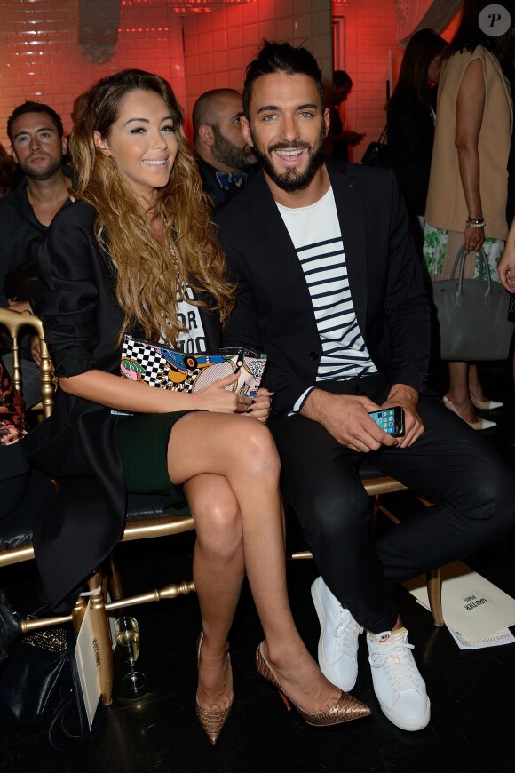 Nabilla Benattia et son amoureux Thomas Vergara assistent au défilé Jean-Paul Gaultier à Paris le 9 juillet 2014