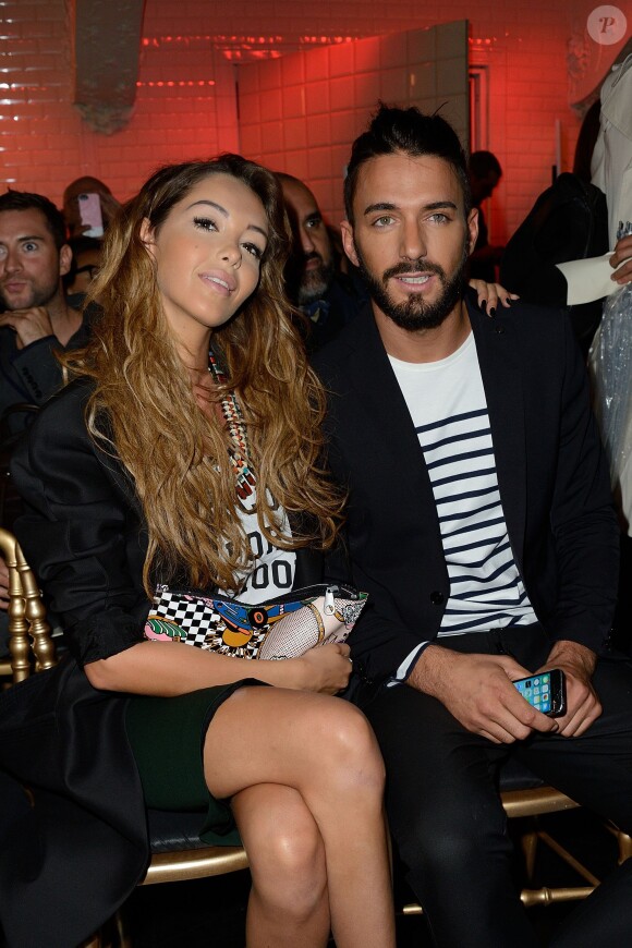 Nabilla Benattia et son amoureux Thomas Vergara assistent au défilé Jean-Paul Gaultier à Paris le 9 juillet 2014
