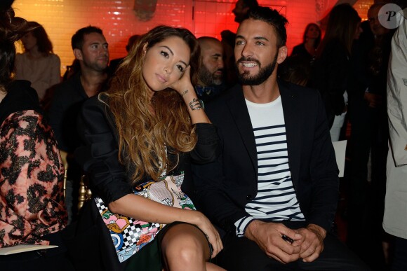 Nabilla Benattia et son amoureux Thomas Vergara assistent au défilé Jean-Paul Gaultier à Paris le 9 juillet 2014