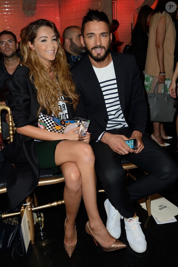 Nabilla Benattia et son amoureux Thomas Vergara assistent au défilé Jean-Paul Gaultier à Paris le 9 juillet 2014