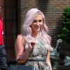 La chanteuse Kesha sort de son hôtel avec son petit ami Brad Ashenfelter à New York, le 29 mai 2014. 