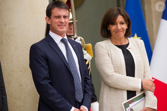 Manuel Valls et Anne Hidalgo, Espagnols d'origine, à l'Elysée lors de la visite officielle du roi Felipe VI et de la reine Letizia d'Espagne le 22 juillet 2014.