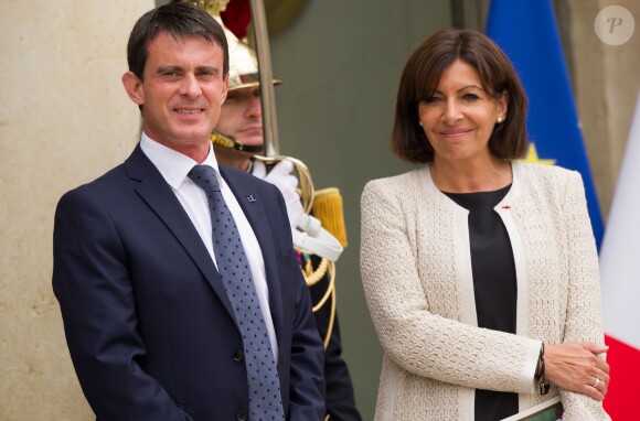 Manuel Valls et Anne Hidalgo, Espagnols d'origine, à l'Elysée lors de la visite officielle du roi Felipe VI et de la reine Letizia d'Espagne le 22 juillet 2014.