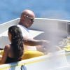 L'animateur de TF1 Vincent Lagaf' arrive sur une plage de Saint-Tropez avec son nouveau bateau de la marque "Cigarette", le 17 juillet 2014.