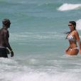 Ludivine Sagna et son époux Bacary sur la plage de Miami durant leurs vancances, le 23 juillet 2014