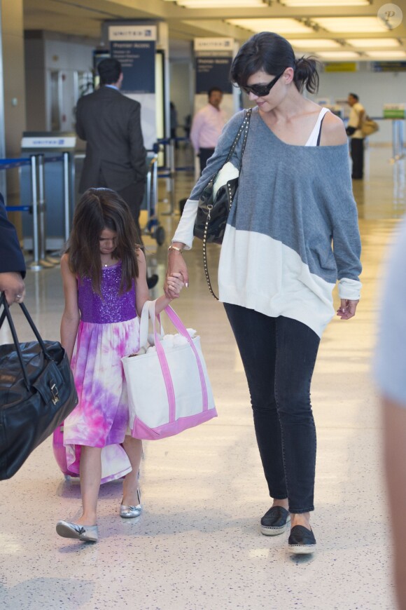 Katie Holmes et Suri Cruise arrivent au JFK airport à New York le 23 juillet 2014.