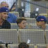 David Beckham et ses fuils Cruz et Romeo assistent au match de baseball des Los Angeles Dodgers au Dodger Stadium. Los Angeles, le 1er août 2014.