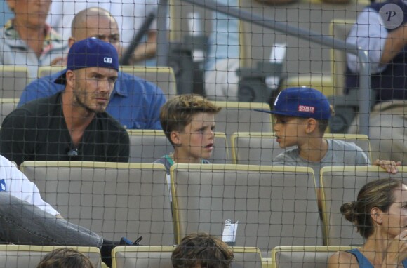 David Beckham et ses fuils Cruz et Romeo assistent au match de baseball des Los Angeles Dodgers au Dodger Stadium. Los Angeles, le 1er août 2014.