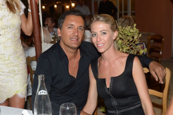 Danny Brillant et sa femme Nathalie au restaurant La Bouillabaisse à Saint-Tropez, à l'occasion d'un dîner organisé par Marcel Campion, le 6 août 2014.