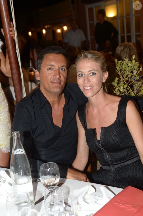 Danny Brillant et sa femme Nathalie au restaurant La Bouillabaisse à Saint-Tropez, à l'occasion d'un dîner organisé par Marcel Campion, le 6 août 2014.