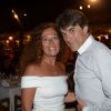Tex et sa femme au restaurant La Bouillabaisse à Saint-Tropez, à l'occasion d'un dîner organisé par Marcel Campion, le 6 août 2014.