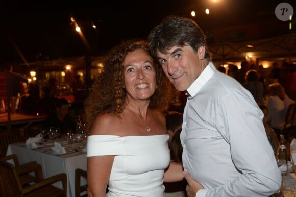 Tex et sa femme au restaurant La Bouillabaisse à Saint-Tropez, à l'occasion d'un dîner organisé par Marcel Campion, le 6 août 2014.