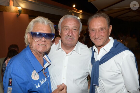 Michou, Bertrand Delanoe et Marcel Campion au restaurant La Bouillabaisse à Saint-Tropez, à l'occasion d'un dîner organisé par Marcel Campion, le 6 août 2014.