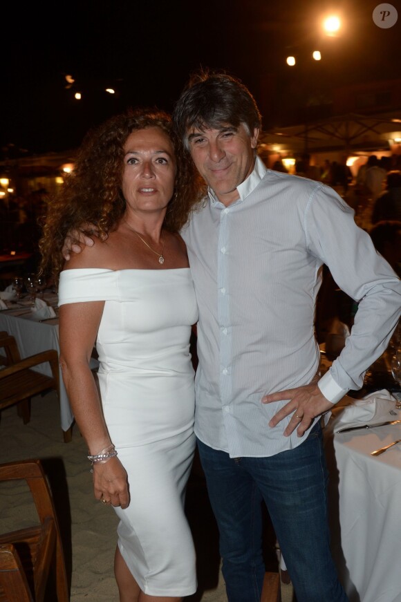 Tex et sa femme au restaurant La Bouillabaisse à Saint-Tropez, à l'occasion d'un dîner organisé par Marcel Campion, le 6 août 2014.