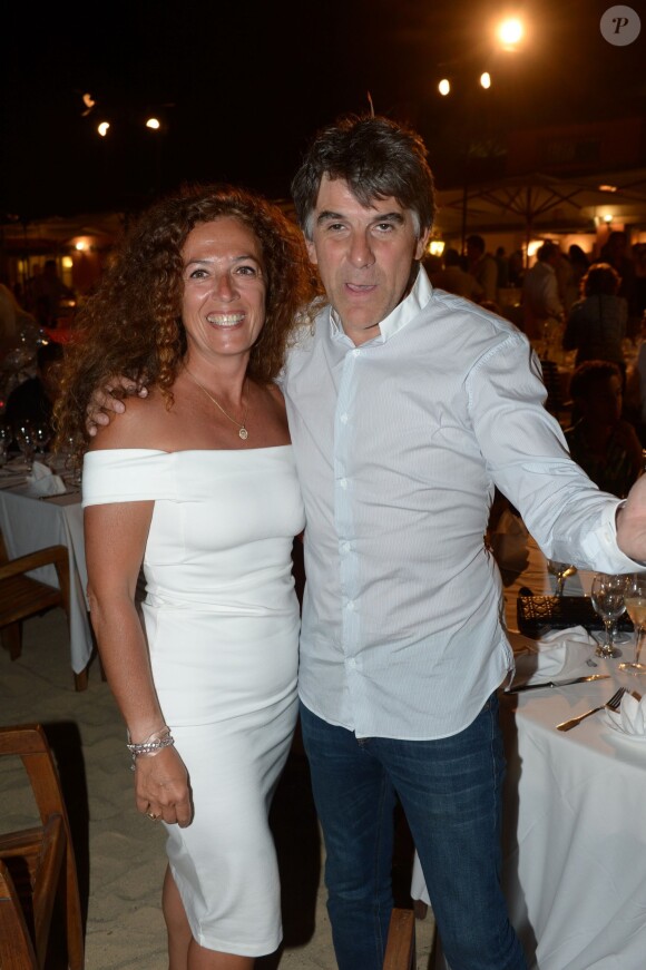 Tex et sa femme au restaurant La Bouillabaisse à Saint-Tropez, à l'occasion d'un dîner organisé par Marcel Campion, le 6 août 2014.