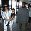 Kim Kardashian, son mari Kanye West et leur fille North prennent un vol à l'aéroport de Los Angeles. Le 1er septembre 2014.