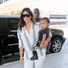 Kim Kardashian, son mari Kanye West et leur fille North prennent un vol à l'aéroport de Los Angeles. Le 1er septembre 2014.